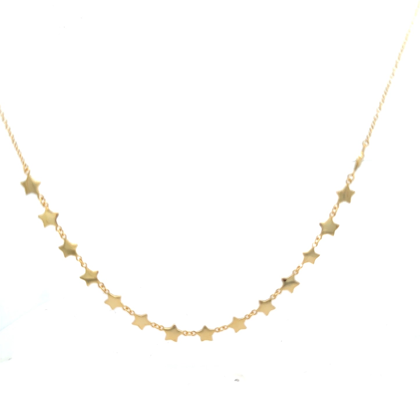 Gold star necklace on a white background
