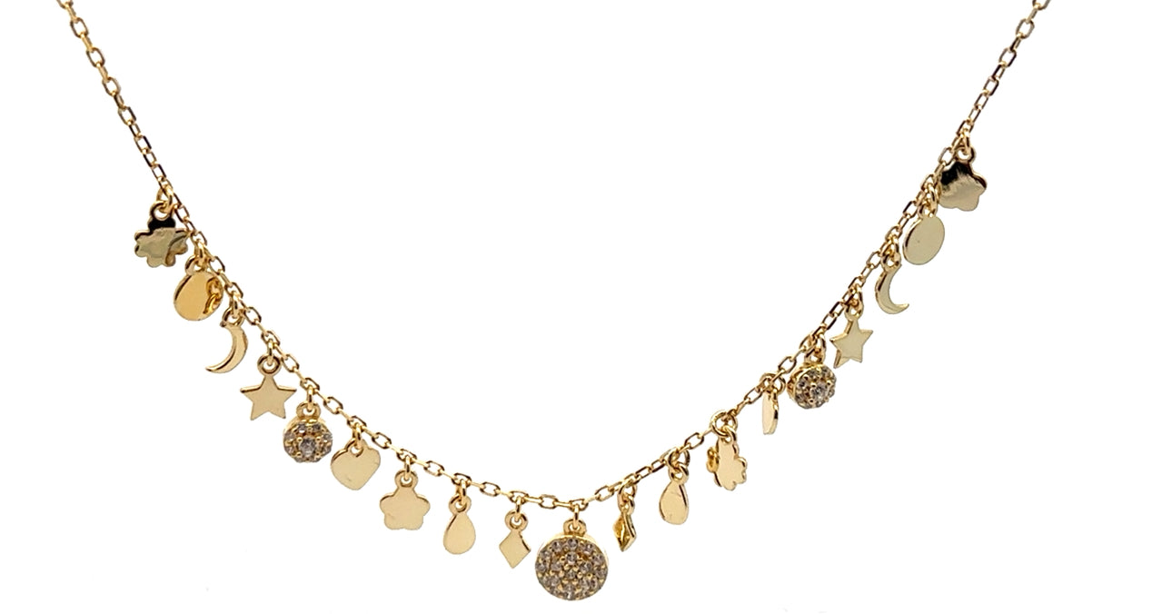 Gold necklace with various charms on a white background